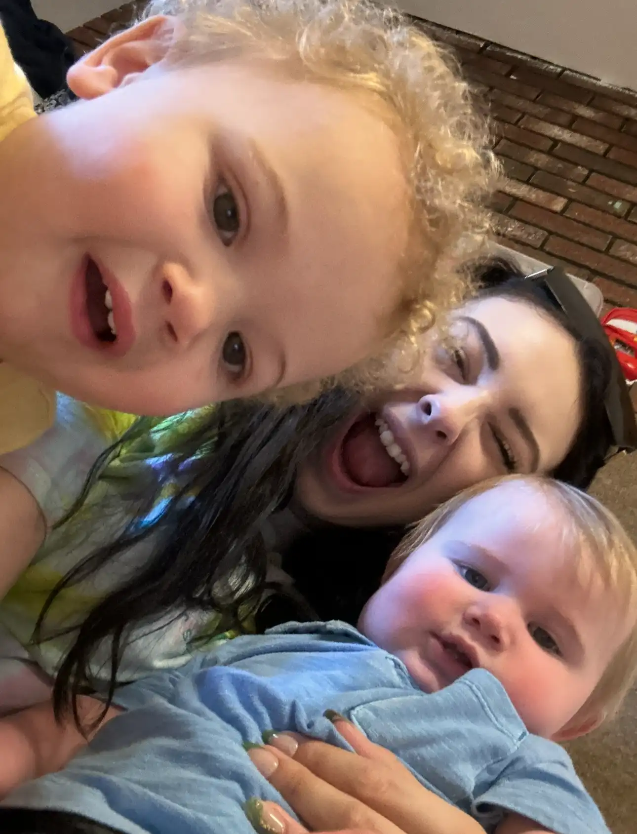 Caregiver and children, all smiles